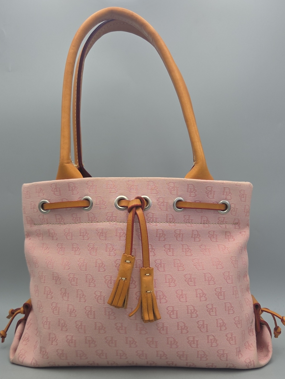 Dooney Bourke DB Monogram Drawstring Tote Canvas Leather Tassel Pink